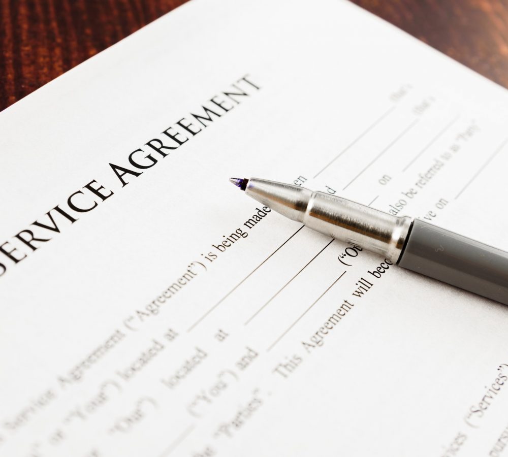 Concept Image of a Service agreement written by a lawyer.